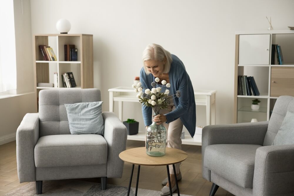 Woman organizing in her memory care apartments.
