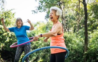 Two senior women exercising outside at the senior living in Palm Springs