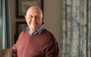 Senior male smiling in assisted living near Palm Springs.