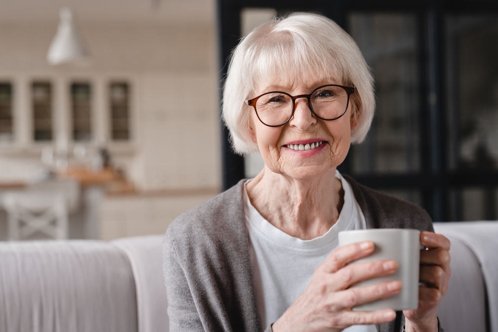 Woman holding coffee in assisted living yorba linda.