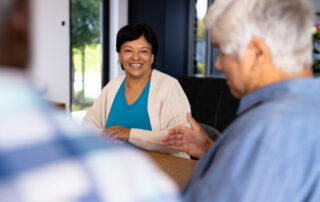 Smiling woman in assisted living with 24-hour care.