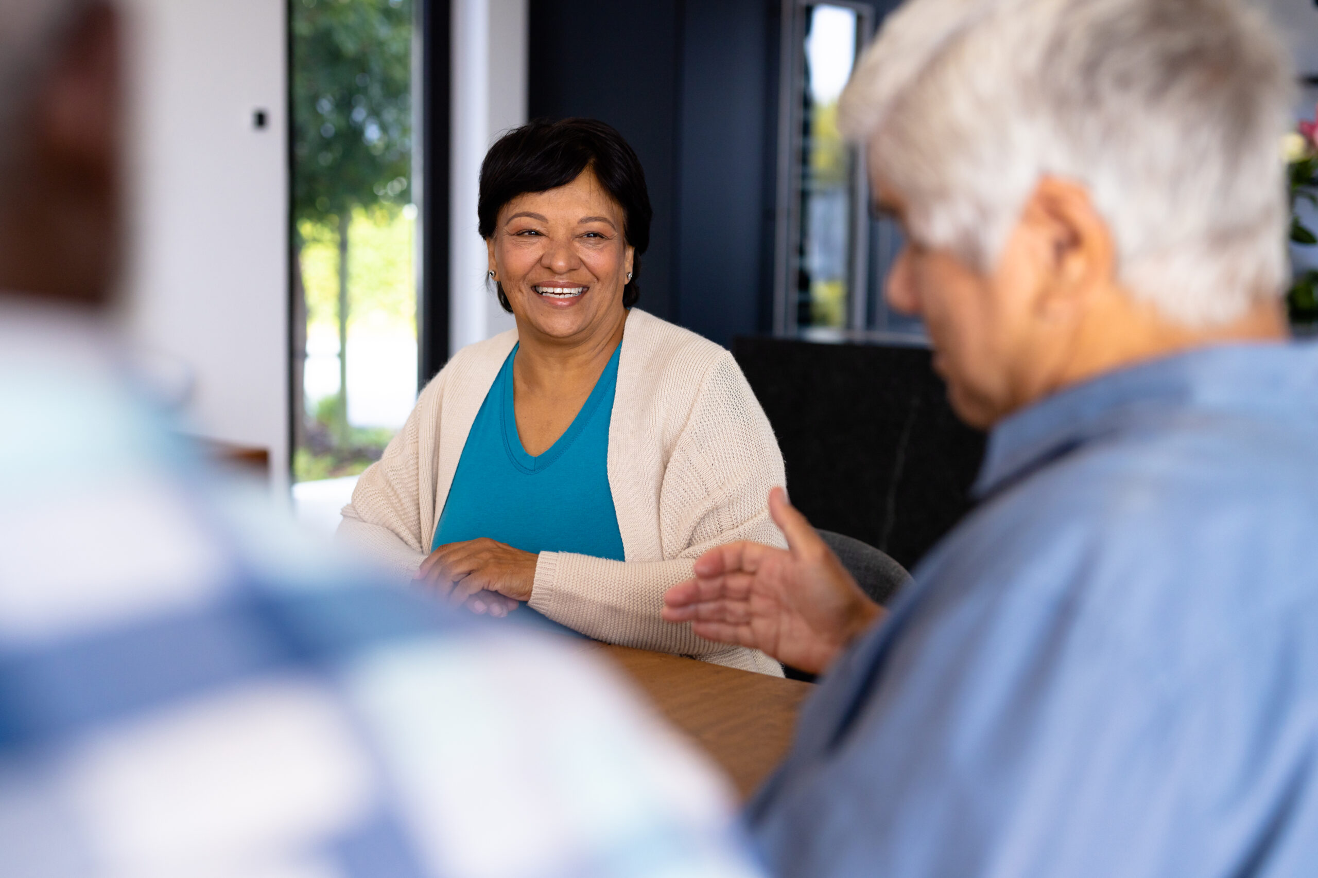 Smiling woman in assisted living with 24-hour care.