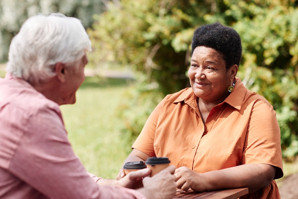 Senior friends outside enjoying the sun and skilled nursing with memory care